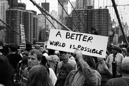 Man holding banner at protest